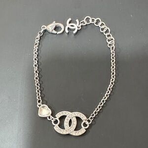Elegant Chanel Silver Bracelet with Heart Charm